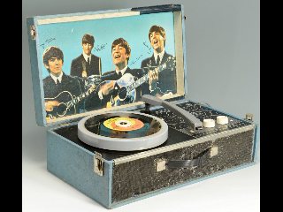 Golden age of vinyl records with The Beatles album on turntable